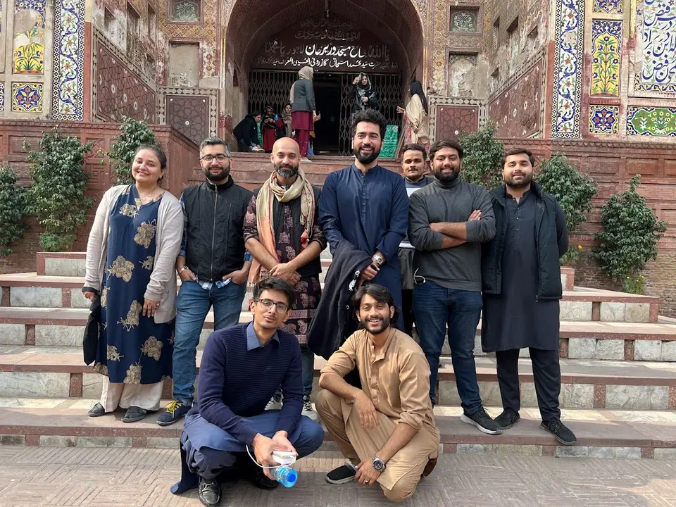 The Lahore ka Ravi team on the steps of Wazir Khan Mosque